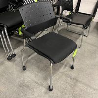 USED STACKING CHAIR W ARMS ON WHEELS
