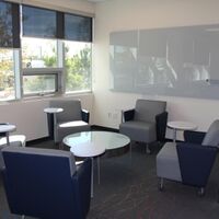 Arcadia Roaster Tablet Chairs, Encore Kenzie Table and Clarus Float Glassboard